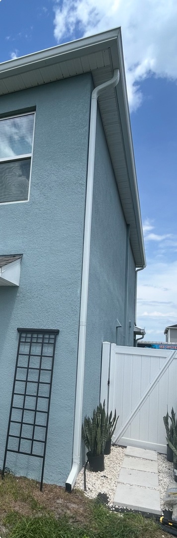 Photo of a two-story downspout.